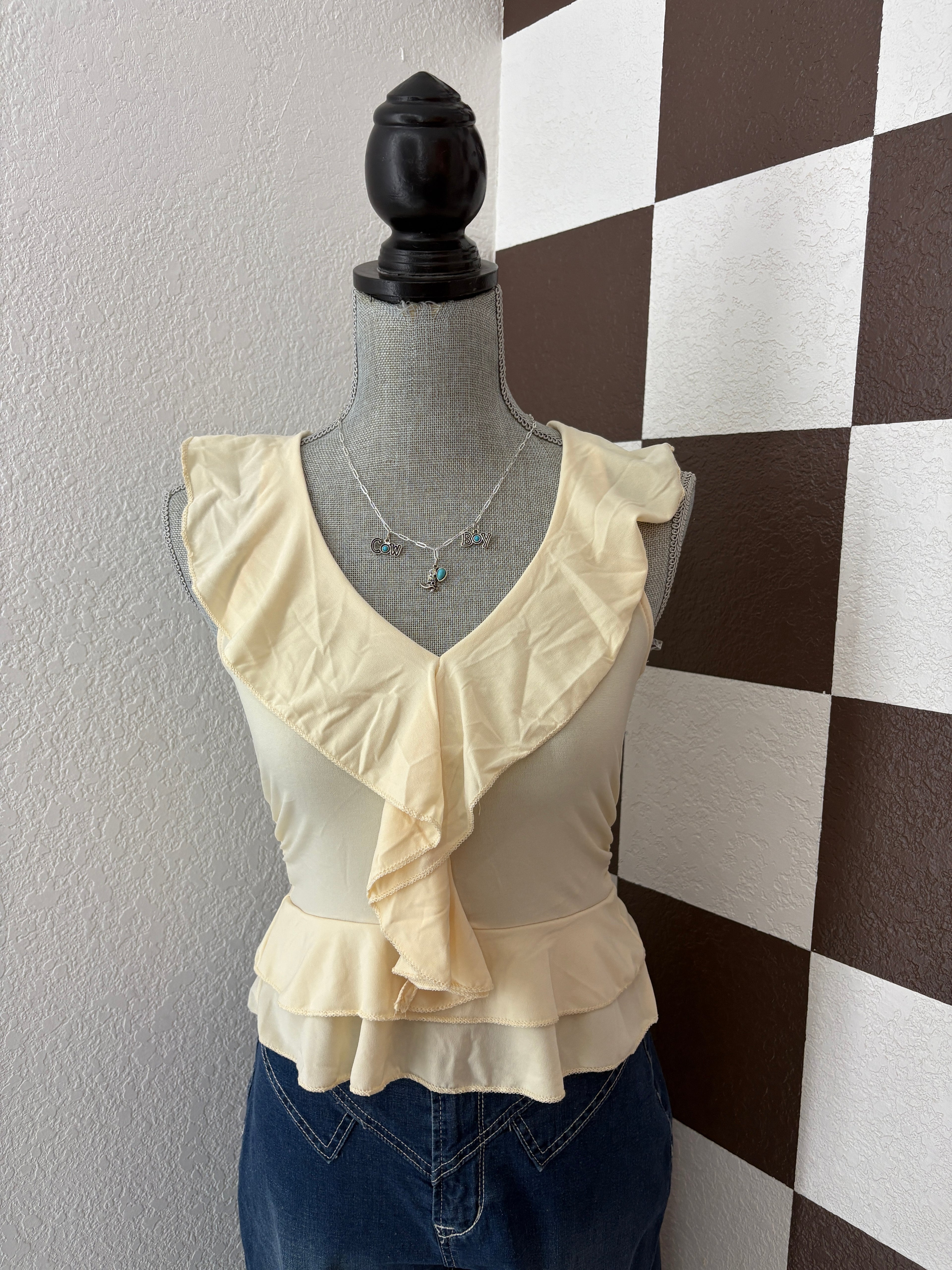 Ruffle Trim Sleevless Peplum Top cream